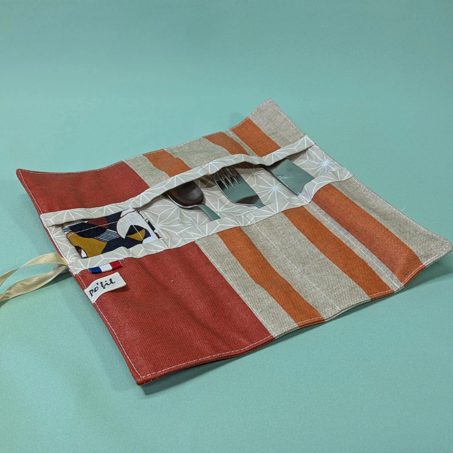 Pochette à couverts, tissu rayé orange Po'fil