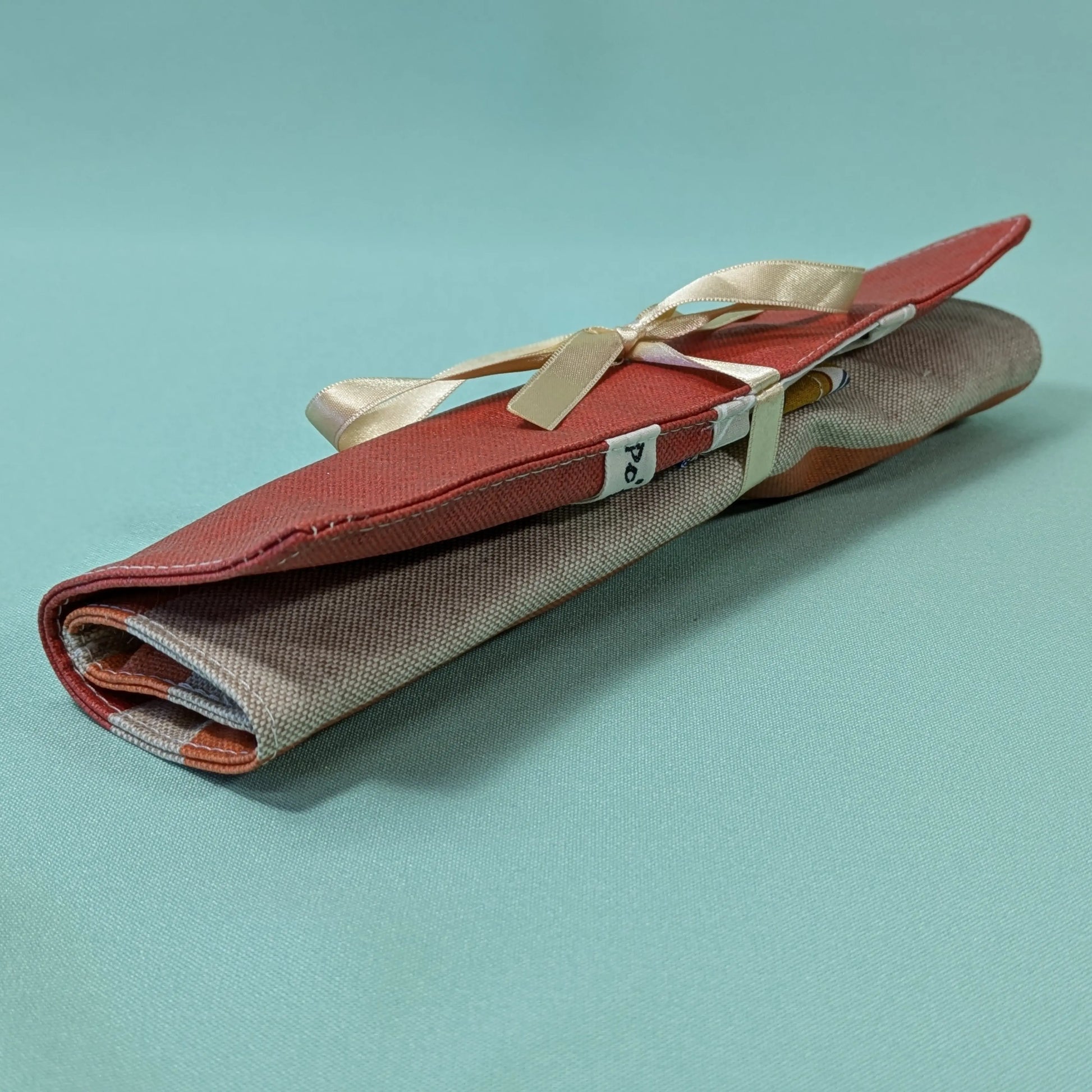 Pochette à couverts, tissu rayé orange Po'fil